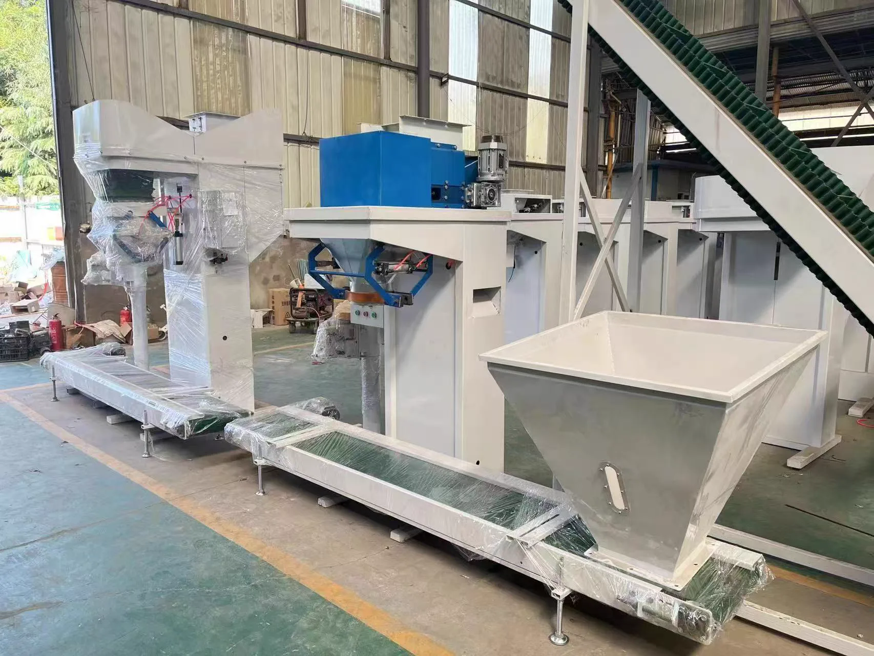 Bagging equipment and conveyors assembled in the workshop