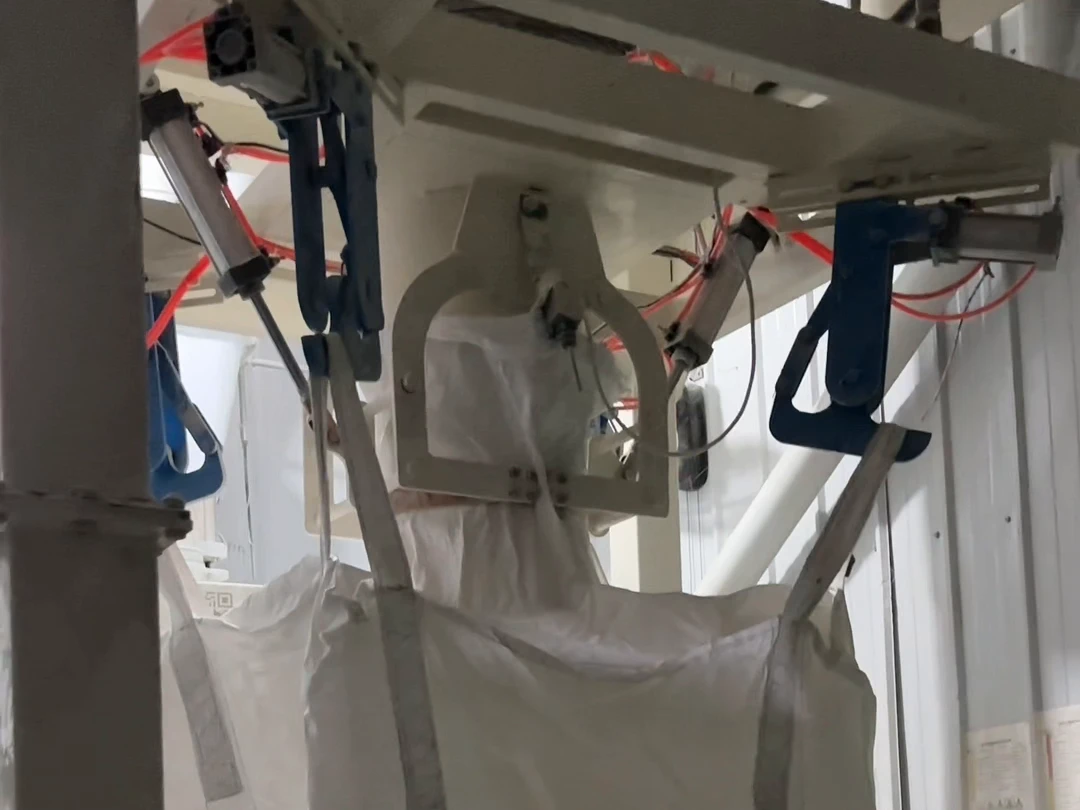 Bulk-bag filling and filled-bag handling at a flour customer site.